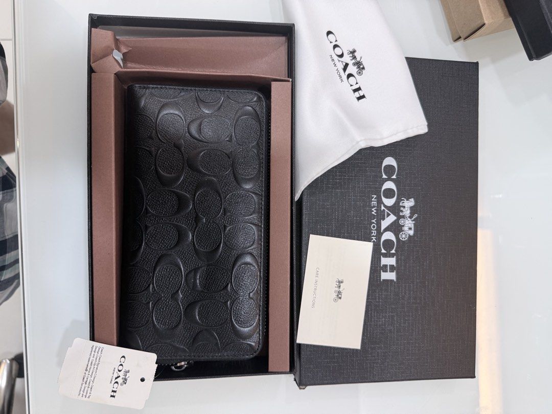Coach Wallet and Keychain Gift Set (Category: Wallets & Card holders) located in Quezon City. Submitted by nichole12 (Listing ID 1469908123, Image 3). Description: - Brand new Coach gift set (Wallet, Card Holder & Keyring) - Premium embossed black leather with signature monogram pattern - Includes original Coach presentation box and care card - Ideal for gifting or personal everyday use - 100% authentic and ready to ship.