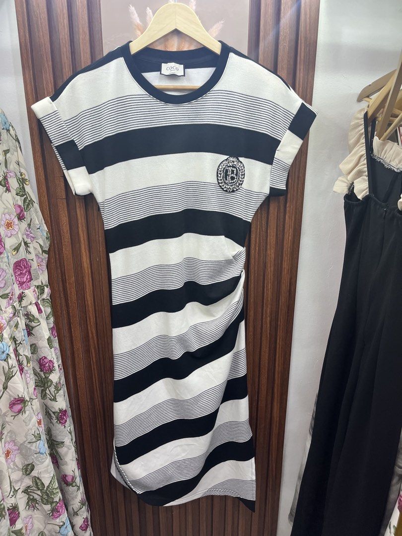 Coco Amoni black and white striped dress (Category: Dresses) located in Kidapawan. Submitted by azythrift (Listing ID 1469864963, Image 1). Description: - Brand: Coco Amoni - Design: Black and white stripes with short sleeves and round neckline - Details: Eye-catching crystal crest badge on the chest and flattering ruched side detail - Length: Midi length - Material: Comfortable cotton blend knit - Condition: Brand new with neck tag and care tags