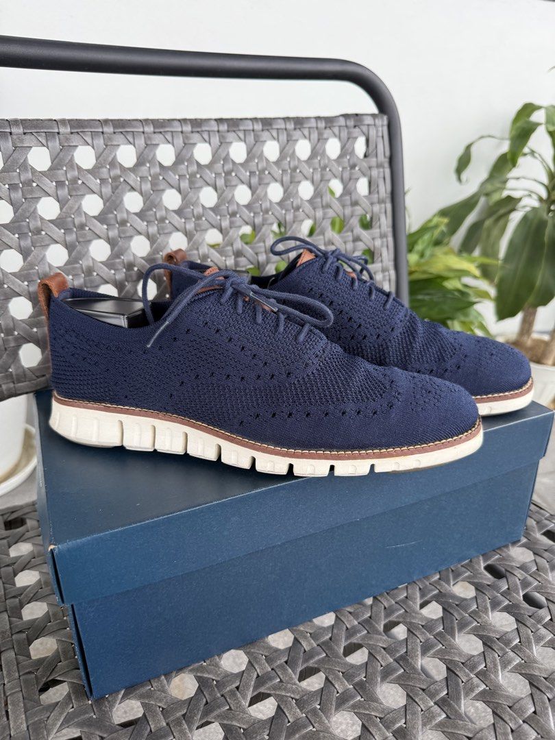 Cole Haan Zerogrand Stichlite (Category: Casual Shoes) located in Quezon City. Submitted by kevinstv3191 (Listing ID 1469781254, Image 2). Description: *NO TRADE/SWAP and LOW BALL OFFER* - Brand: Cole Haan - Model: Zerogrand Stichlite - Color: Navy Blue with tan leather accents - Size: US 9.5M (EU 42 / UK 8) - Material: Breathable knit upper, leather lining, and flexible sole - Condition: Excellent pre-loved condition, includes original box - New
