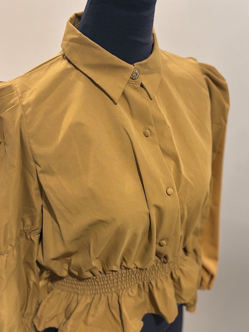 Collared Blouse with Ruffled Waist (Category: Blouses) located in Santa Cruz. Submitted by zellethrifts (Listing ID 1469927467, Image 3). Description: • Bought in Zara Japan 🇯🇵 • Brand new / unused • Fits medium to large • In excellent condition • Photos taken using mannequin only 🚚 Shipping via J&T only 📦 Shipping fee to be shouldered by buyer 💳 Mode of payment: GCash 📍 Santa Cruz, Laguna.