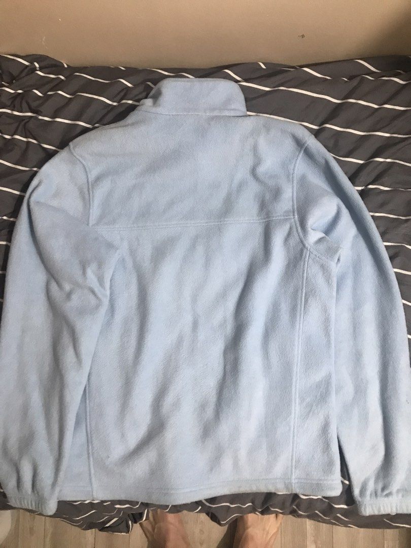 Columbia Light Blue Fleece Jacket (Category: Coats, Jackets and Outerwear) located in Baguio. Submitted by mintchoc1 (Listing ID 1469816953, Image 3). Description: - Brand: Columbia - Color: Light/Baby Blue - Size: Medium - Material: Soft and cozy fleece - Features: Full-zip closure, high collar for extra warmth, and two zippered side pockets - Details: Embroidered Columbia logo on the left chest and solid back - Condition: Great for layering on 