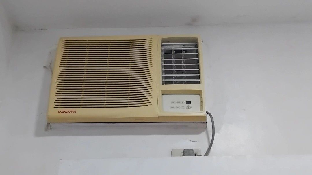 Condura Window Type Air Conditioner Inverter (Category: Air Conditioning and Heating) located in Cebu City. Submitted by sherosales (Listing ID 1469876258, Image 1). Description: - Brand: Condura Window Type AC - Status: Currently installed and running (tested and working) - Features: Digital control panel with display, vertical and horizontal airflow louvers - Cosmetic condition: Cream-colored casing has some yellowing due to age - Php 10k, slig