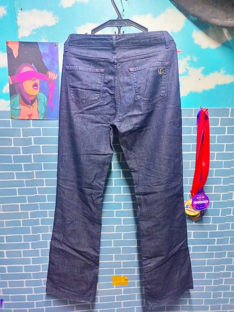 Cookie Johnson Grace Boot Cut Dark Wash Jeans (Category: Jeans) located in Caloocan City. Submitted by silvergem_b94b67 (Listing ID 1469758937, Image 2). Description: - Brand: Cookie Johnson (Model: Grace Boot Cut) - Wash: Clean dark indigo wash with solid stitch details - Fit: Flattering bootcut leg silhouette with standard belt loops - Details: Classic fly front with button closure, standard front and back pockets - Special Features: Cute pink 