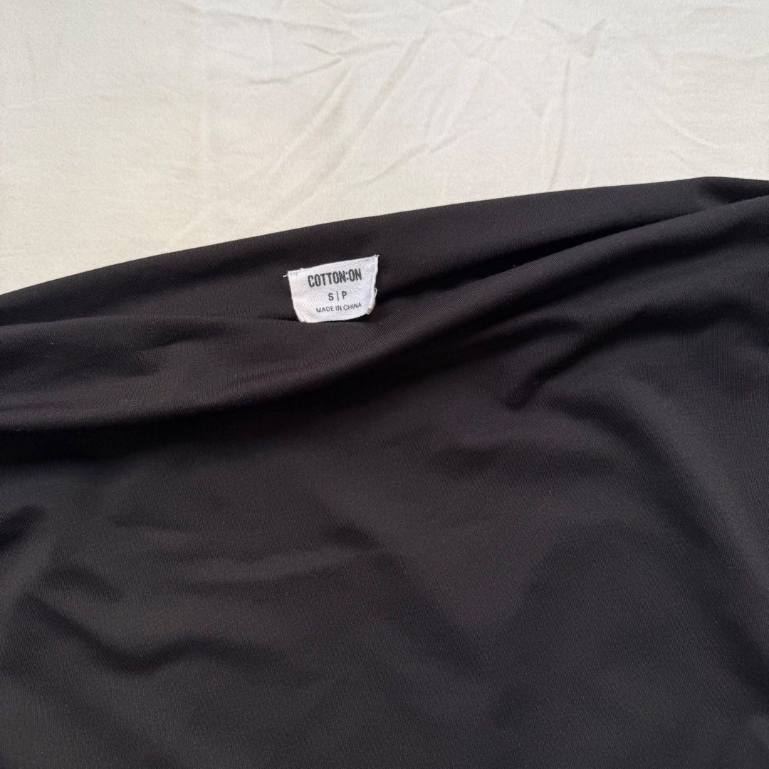 Cotton On Black Off-Shoulder Top Size S (Category: Blouses) located in Pasig City. Submitted by notshynotmeee (Listing ID 1469809020, Image 2). Description: - Brand: Cotton On - Style: Off-shoulder top with draped neckline and cap sleeves - Color: Black - Size: Small - Material: Soft and stretchy fabric - Condition: Pre-loved, worn a couple of times, solid condition - Versatile piece, easy to pair with jeans or skirts.