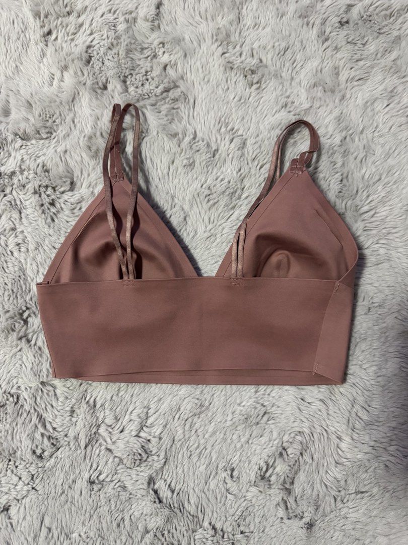 Cotton On Body Pink Bralette (Category: Undergarments & Loungewear) located in Calamba. Submitted by cheriiv (Listing ID 1469883719, Image 2). Description: - Brand: BODY - Size: Small (tag attached) - Neckline: V-neck cut with thin double straps - Material: Smooth, seamless fabric all over - Condition: Clean inside and out, brand new and ready to wear.