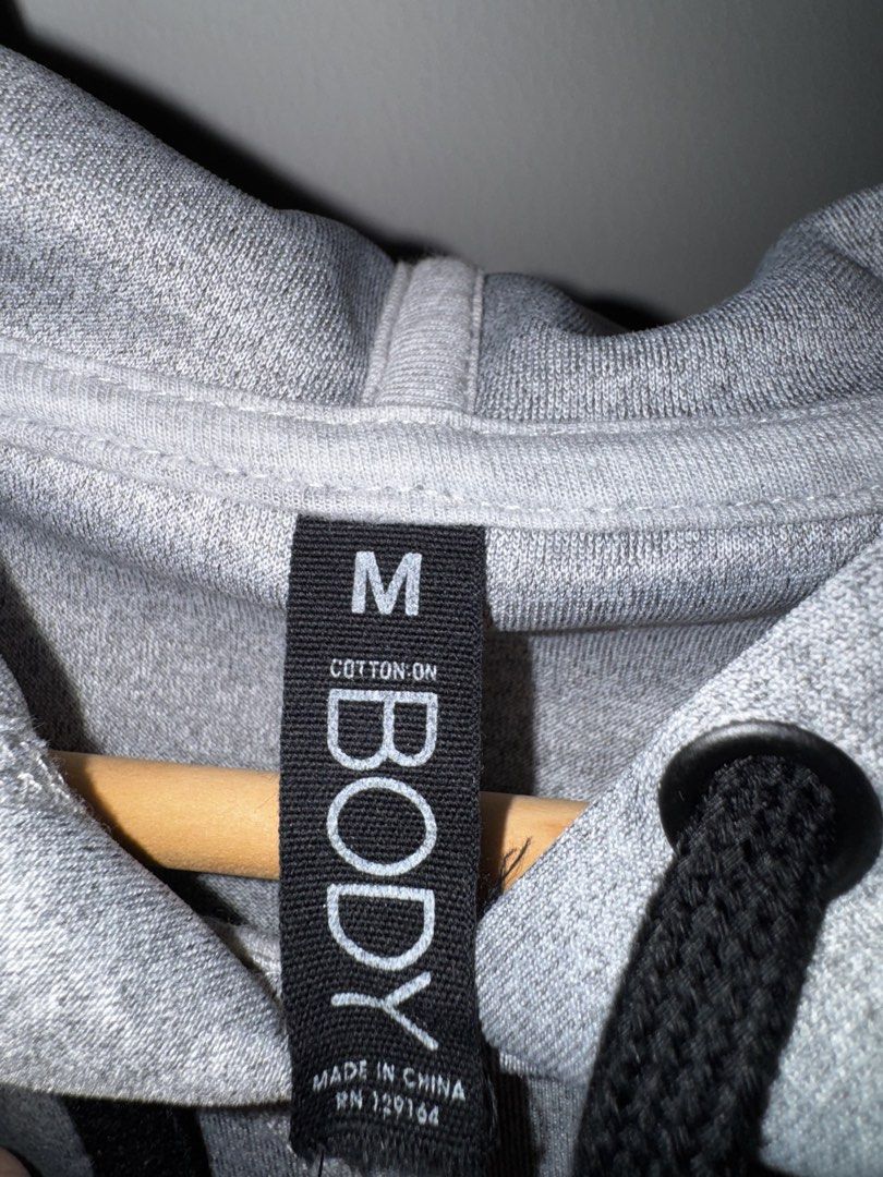 Cotton On Gray Sweatshirt with Hood (Category: Activewear) located in Quezon City. Submitted by coolmomma (Listing ID 1469855479, Image 3). Description: Good as new Length 22 in. Medium on tag but can fit small to medium.