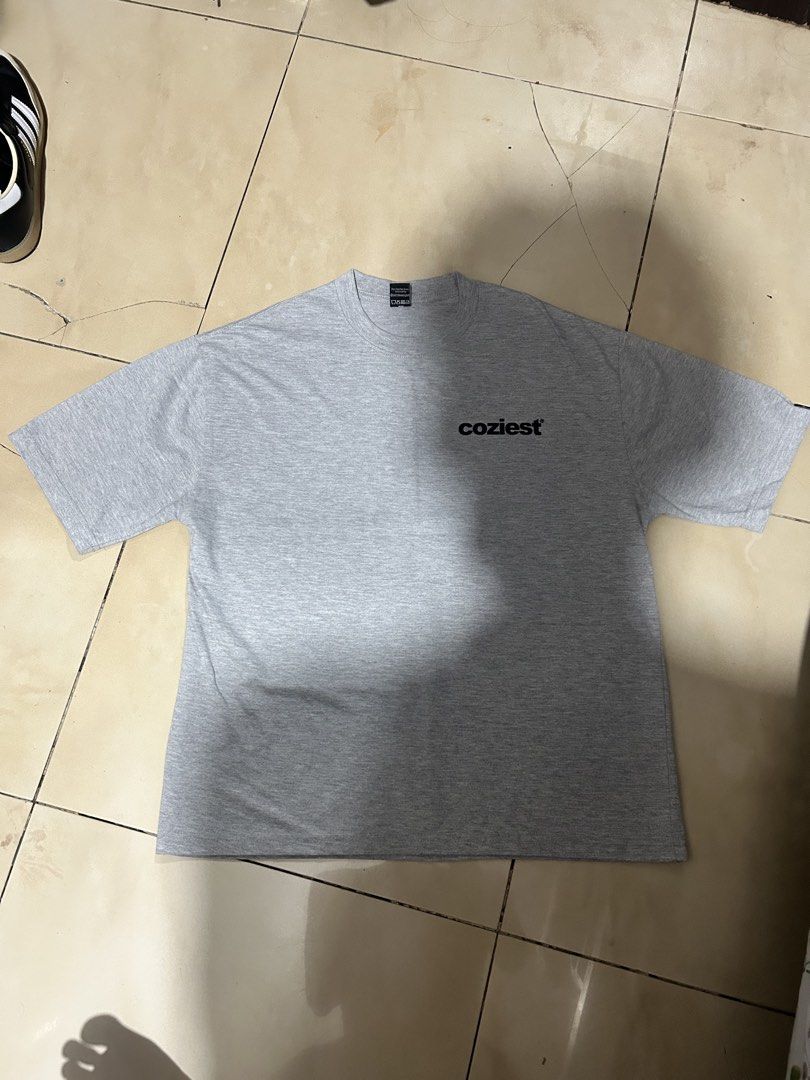 Coziest Heather Grey T-shirt (Category: Tshirts & Polo Shirts ) located in Manila. Submitted by zenforest-7e6908 (Listing ID 1469921818, Image 1). Description: - Color: Heather Grey - Style: Crew neck, short-sleeve basic tee - Design: Features a super cozy chest logo - Versatility: Neutral color matches any outfit - Condition: Excellent everyday staple piece.