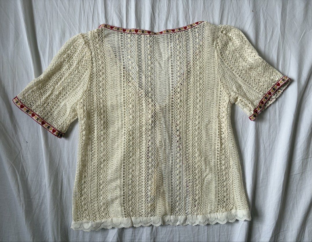 Cream Crochet Cover up Cardigan with String (Category: Coats, Jackets and Outerwear) located in Quezon City. Submitted by vidadmarie (Listing ID 1469819025, Image 2). Description: - Color/Style: Cream crochet knit cardigan with short sleeves and open front - Details: Red and yellow floral ribbon trim along the neckline, placket, and cuffs - Closure: Chest tie with playful tassel accents - Hem: Delicate scalloped eyelet lace border - Never worn - 