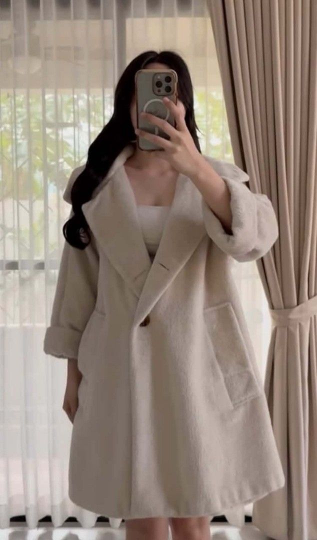 Cream Long Wool Coat (Category: Coats, Jackets and Outerwear) located in Pasig City. Submitted by ohhbrey (Listing ID 1469912698, Image 1). Description: - Color: Cream - Style: Mid-thigh length, relaxed fit - Size: Large - Details: Wide lapel collar, deep front pockets, cuffed wrists, single button closure - Material: Thick, cozy wool for cold weather - Condition: Worn a couple of times, super clean.