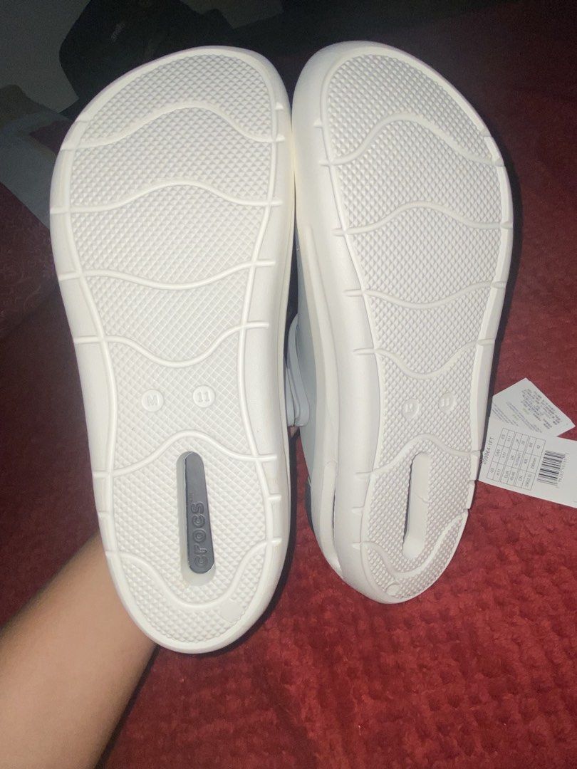 Crocs Inmotion Clog Grey White Size Men 11 (Category: Slippers & Slides) located in Manila. Submitted by almazankyle19 (Listing ID 1469844096, Image 3). Description: -NOT GUARANTEED AUTHENTIC - Brand new with original tags attached, never worn - Color: Light grey and white - Size: Men US 11 / Women US 13 / EUR 45-46 - Design: Ventilation holes across the upper for breathability - Comfort: Dual-density sole equipped with LiteRide footbed.