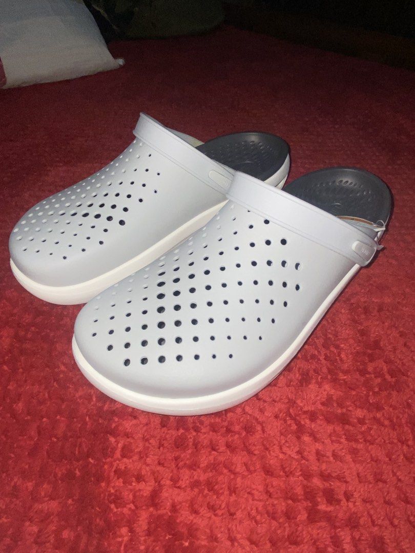 Crocs Inmotion Clog Grey White Size Men 11 (Category: Slippers & Slides) located in Manila. Submitted by almazankyle19 (Listing ID 1469844096, Image 2). Description: -NOT GUARANTEED AUTHENTIC - Brand new with original tags attached, never worn - Color: Light grey and white - Size: Men US 11 / Women US 13 / EUR 45-46 - Design: Ventilation holes across the upper for breathability - Comfort: Dual-density sole equipped with LiteRide footbed.