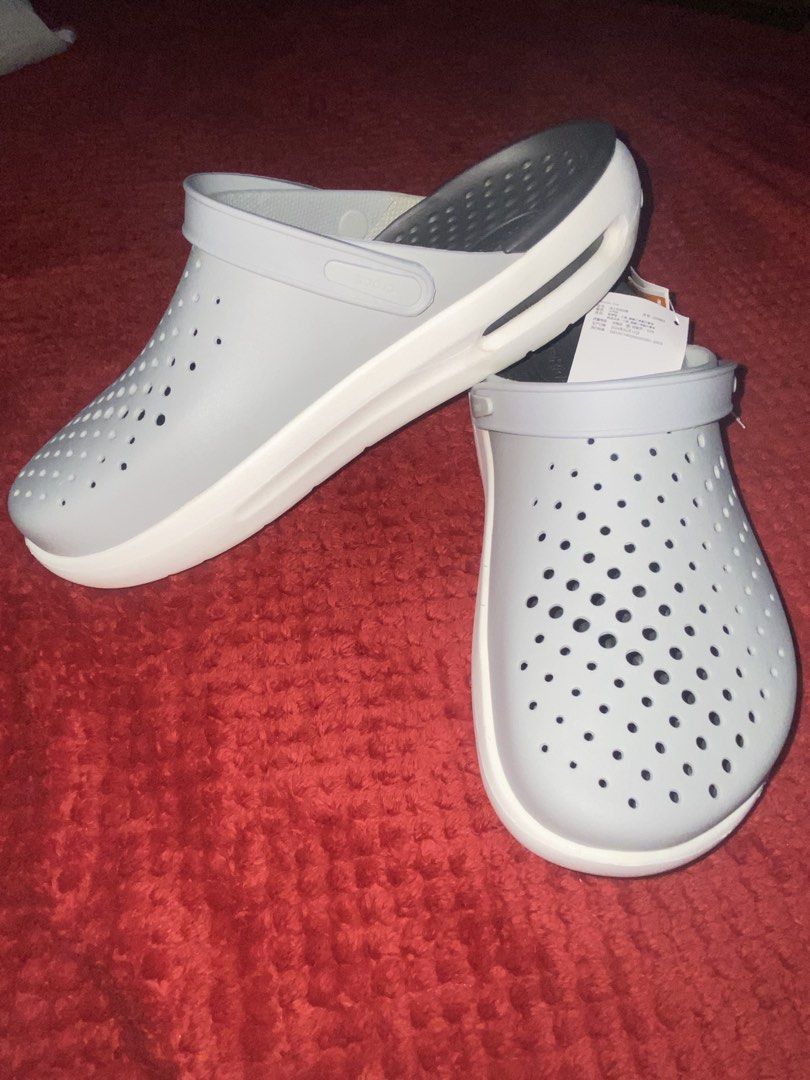 Crocs Inmotion Clog Grey White Size Men 11 (Category: Slippers & Slides) located in Manila. Submitted by almazankyle19 (Listing ID 1469844096, Image 1). Description: -NOT GUARANTEED AUTHENTIC - Brand new with original tags attached, never worn - Color: Light grey and white - Size: Men US 11 / Women US 13 / EUR 45-46 - Design: Ventilation holes across the upper for breathability - Comfort: Dual-density sole equipped with LiteRide footbed.