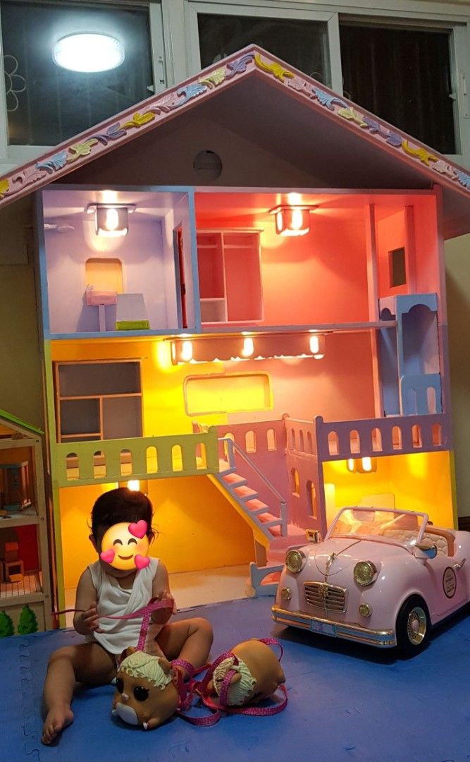 Customized Solid wood multi-story dollhouse with lights and furnitures (Category: Kids Toys) located in Binan City. Submitted by lesly.ly (Listing ID 1469908071, Image 1). Description: - Multi-story wooden dollhouse with sturdy construction and colorful painted details - Features working lights in the rooms, balconies, stairs, and a built-in closet on the top floor - Perfect gift for birthdays and special occasions *Note: This is really heavy and