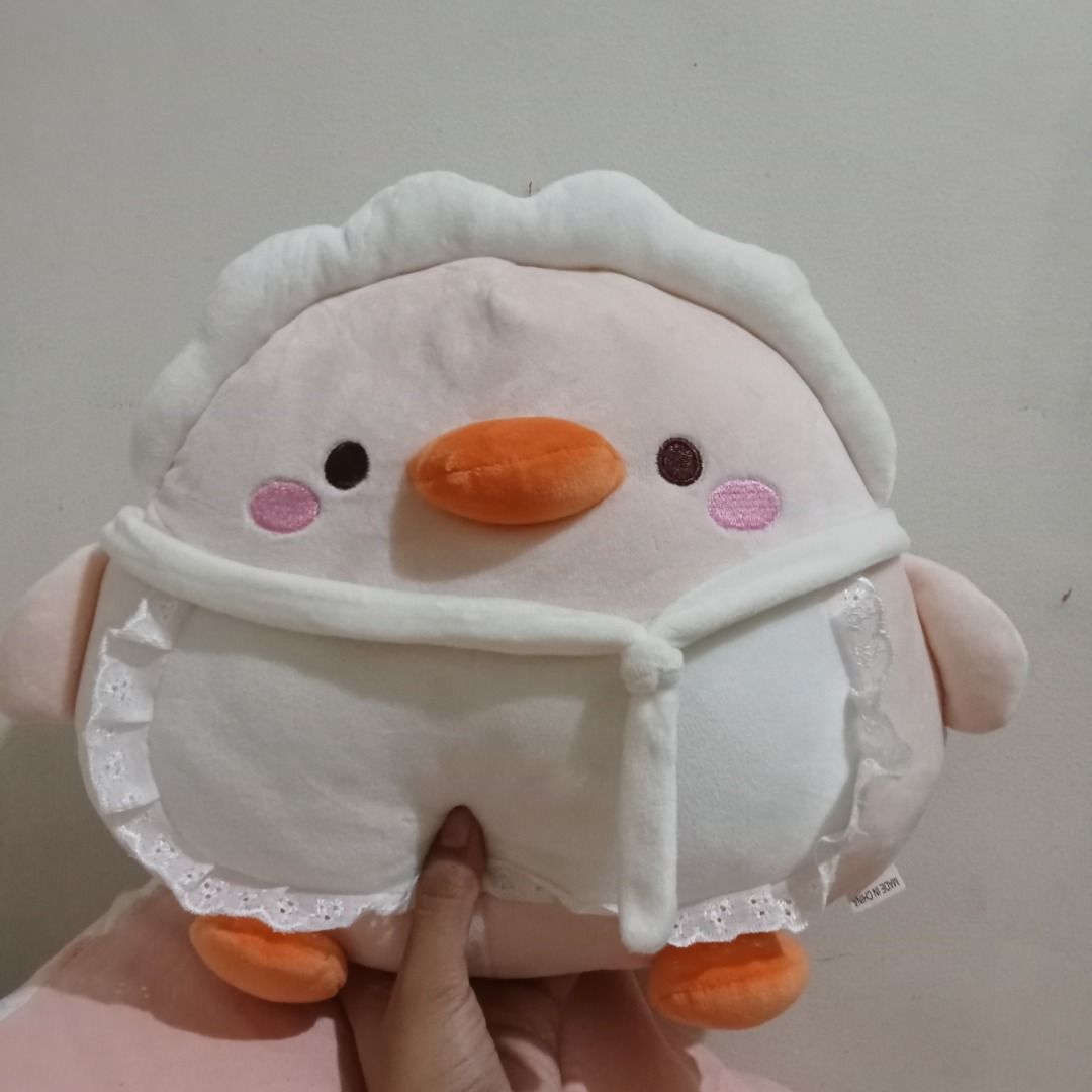 Cute Duck Plush Toy with White Apron mallow type (Category: Plushies & Soft Toys) located in Quezon City. Submitted by trinket_cat (Listing ID 1469850237, Image 1). Description: - Adorable soft pink duck plush with cute pink cheeks - Wears a charming white apron with lace trim - Very huggable and round-shaped body - Clean fabric, 100% stain-free and undamaged - Perfect for gifts, collecting, or cute room decor.