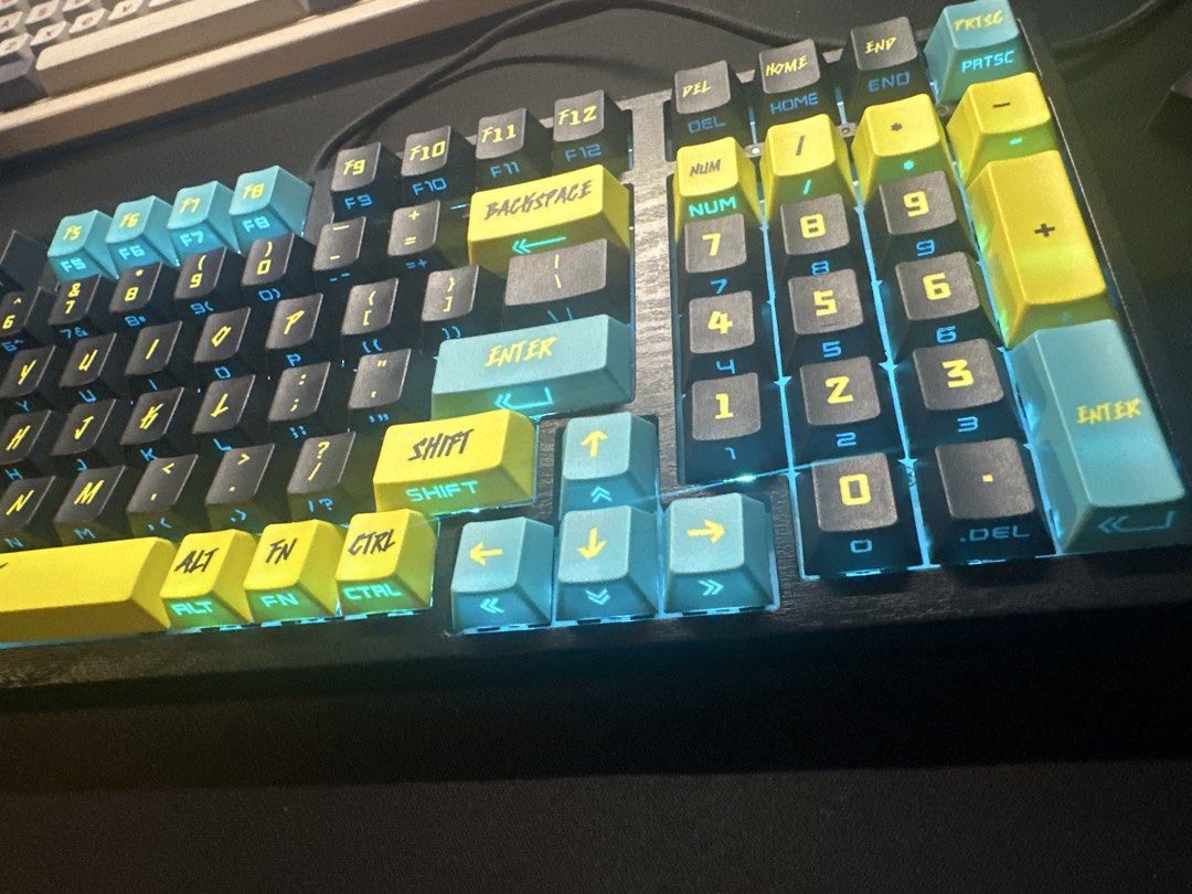 Cyberpunk Themed Mechanical Keyboard (Category: Computer Keyboard) located in Pasay City. Submitted by dandeclutter (Listing ID 1469875356, Image 3). Description: • Cyberpunk-themed keycaps. (New) • Includes spare/extra keycaps. • RGB Black chassis with woodgrain texture. • 96% Keyboard layout. • RGB backlighting with customizable effects. (FN+Arrow keys) ⚠️ No cable included. (Type-C) Switches: Khalil Box White (Clicky) Keyboard brand: Tbh I don