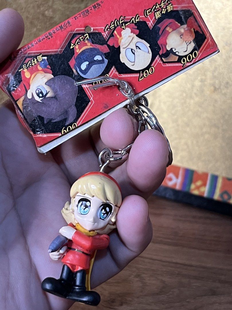 Cyborg 009 Figure Key Holder Banpresto 2001 (Category: Figurines & Statues) located in Gapan. Submitted by lunashop14 (Listing ID 1469798751, Image 2). Description: - Rare 2001 Banpresto Cyborg 009 figure key holder - Classic design featuring red outfit and yellow cape with stamped copyright - Comes with original Japanese cardboard tag packaging - Secure keychain hardware attached - Perfect addition for vintage anime and manga collectors.