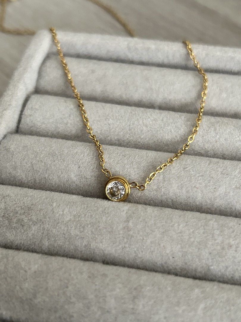 Dainty Gold Chain (Round) (Category: Necklaces) located in Manila. Submitted by elonlineshop (Listing ID 1469785175, Image 2). Description: - Style: Dainty gold chain with a single round stone in a bezel setting - Versatility: Lightweight and easy to layer or wear on its own for everyday use - Note: No box included -Stainless Steel.