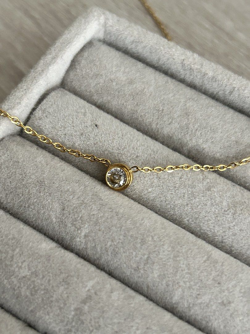 Dainty Gold Chain (Round) (Category: Necklaces) located in Manila. Submitted by elonlineshop (Listing ID 1469785175, Image 1). Description: - Style: Dainty gold chain with a single round stone in a bezel setting - Versatility: Lightweight and easy to layer or wear on its own for everyday use - Note: No box included -Stainless Steel.