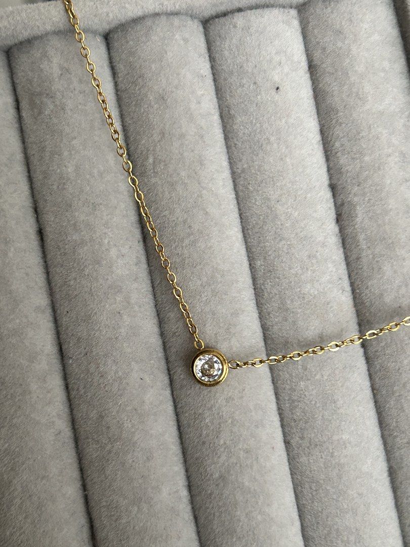Dainty Gold Chain (Round) (Category: Necklaces) located in Manila. Submitted by elonlineshop (Listing ID 1469785175, Image 3). Description: - Style: Dainty gold chain with a single round stone in a bezel setting - Versatility: Lightweight and easy to layer or wear on its own for everyday use - Note: No box included -Stainless Steel.