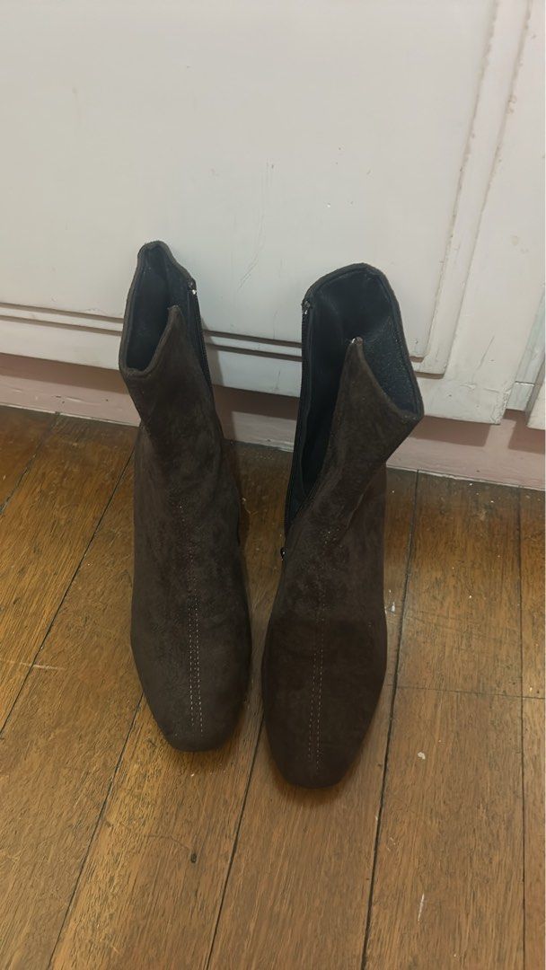 Dark Brown Suede Ankle Boots With Side Zipper (Category: Boots) located in Manila. Submitted by kayjeee (Listing ID 1469776780, Image 1). Description: - Material: Soft dark brown suede - Heel: Mid-height block heel - Toe Shape: Trendy squared toe - Closure: Functional inner-side zippers - Design: Vertical front-center stitching detail - Fit: Standard ankle height shaft with clean lining - Style: Versatile footwear for cooler weather outfits.