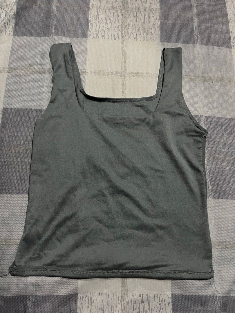 Dark grey square neck tank top (Category: Sleeveless) located in Legazpi City. Submitted by chynnunez (Listing ID 1469875203, Image 1). Description: - Color: Dark grey - Design: Square neckline with thick straps - Fit: Comfortable and stretchable - Fabric: Smooth and soft - Condition: Excellent, clean with no stains or damage - Styling: Easy to match with jeans or shorts.