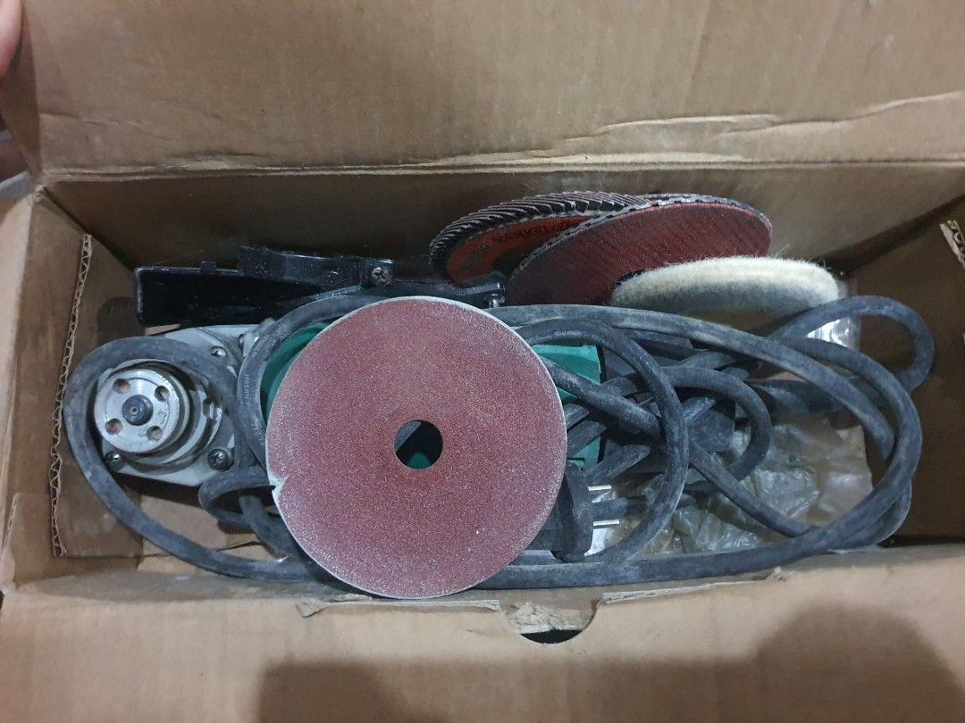 DCA ASM02-100A Angle Grinder (Category: Construction Tools & Equipment) located in Paranaque City. Submitted by nicessities (Listing ID 1469807468, Image 3). Description: - Model: DCA ASM02-100A Angle Grinder (220V) - Color: Green and Black - Condition: Great working condition with original box, personal use, Rarely used - Inclusions: Power cord plus multiple sanding and grinding discs - Ideal Use: Metal cutting, surface prep, and DIY workshop pr