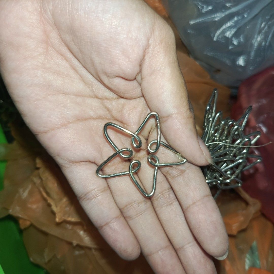 Decorative Metal Wire (Category: Hooks & Hangers) located in Bulacan. Submitted by snumxxx (Listing ID 1469802520, Image 3). Description: -₱200 for 10pcs - Lot of decorative metal wire hooks - Silver tone finish with flower, star, and scroll designs - Heavy and sturdy construction - Ideal for curtains, drapes, and craft projects - Multiple pieces available in this bundle - Decluttering sale, grab them quick!.