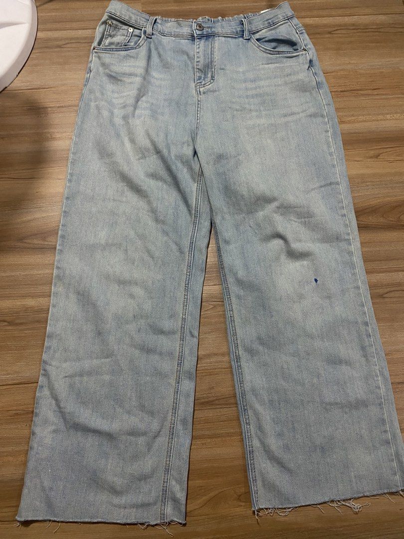 Denim 34" to 40" length 39" (Category: Jeans) located in Bulacan. Submitted by Spothings (Listing ID 1469884484, Image 1). Description: Light wash denim jeans with a wide leg fit. Elastic waistband at the back for extra stretch and comfort. Raw frayed hems at the bottom. Dark contrast stitching outlines the back pockets. Mid-rise style with front button and zipper closure. Light distressing and fading throughout. Great casual staple for everyday 