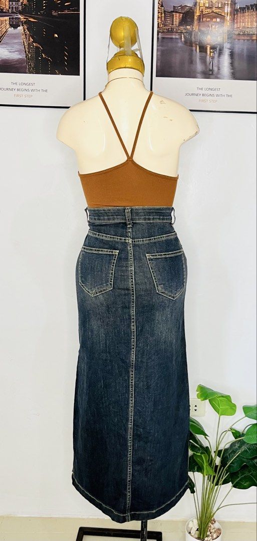 Denim Long Skirt | S: 22-24 (Category: Skirts) located in Manila. Submitted by bengirlclothing (Listing ID 1469766566, Image 3). Description: - Style: Dark wash denim midi skirt with a straight silhouette -Size: 22-24 inches -Length: 34 inches - Details: Contrast stitching, front and back pockets, and a front slit for easy movement - Pairing: Great for casual everyday wear with tanks or tees.