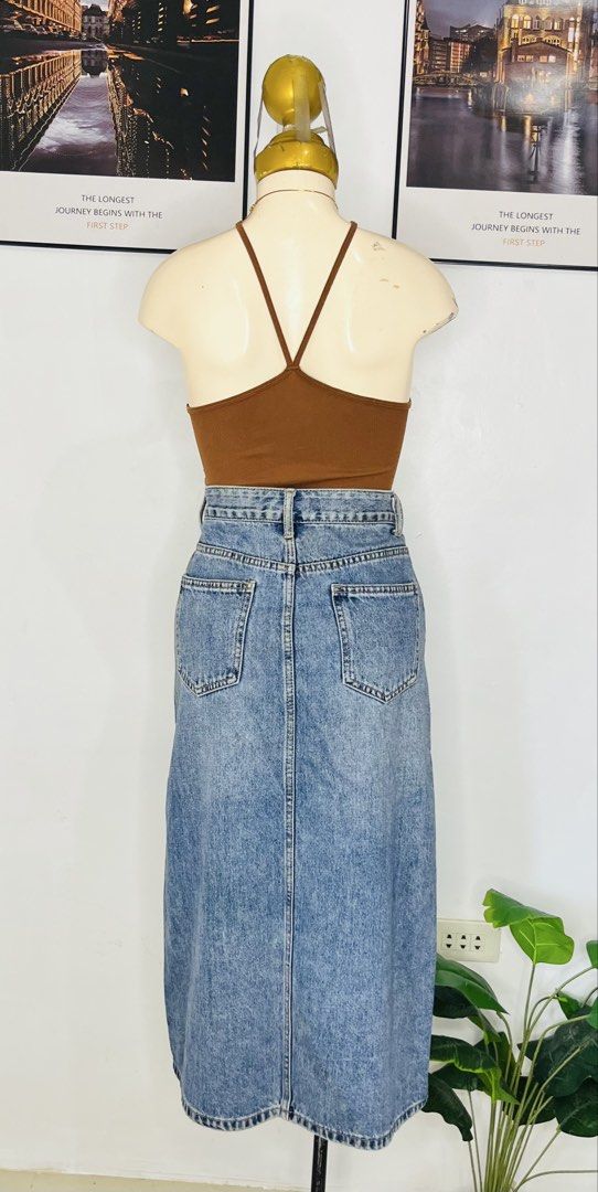 Denim Long Skirt | S: 26-28 (Category: Skirts) located in Manila. Submitted by bengirlclothing (Listing ID 1469765512, Image 3). Description: - Style: Long blue denim midi skirt -Size: 26-28 inches -Length : 32 inches - Details: Darker wash patch on the right hip and a subtle front slit for easy movement.