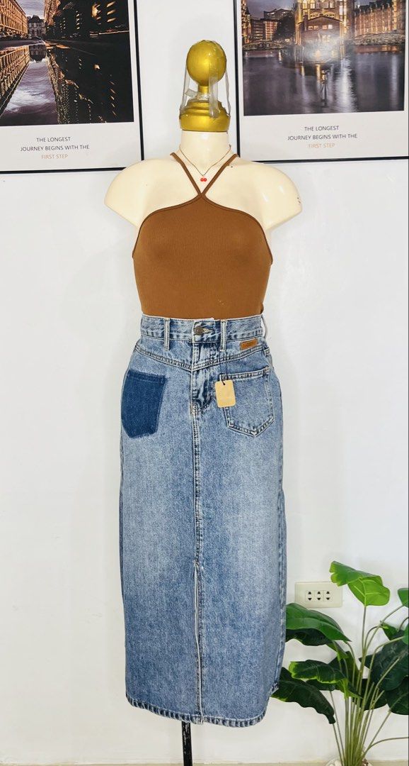 Denim Long Skirt | S: 26-28 (Category: Skirts) located in Manila. Submitted by bengirlclothing (Listing ID 1469765512, Image 2). Description: - Style: Long blue denim midi skirt -Size: 26-28 inches -Length : 32 inches - Details: Darker wash patch on the right hip and a subtle front slit for easy movement.