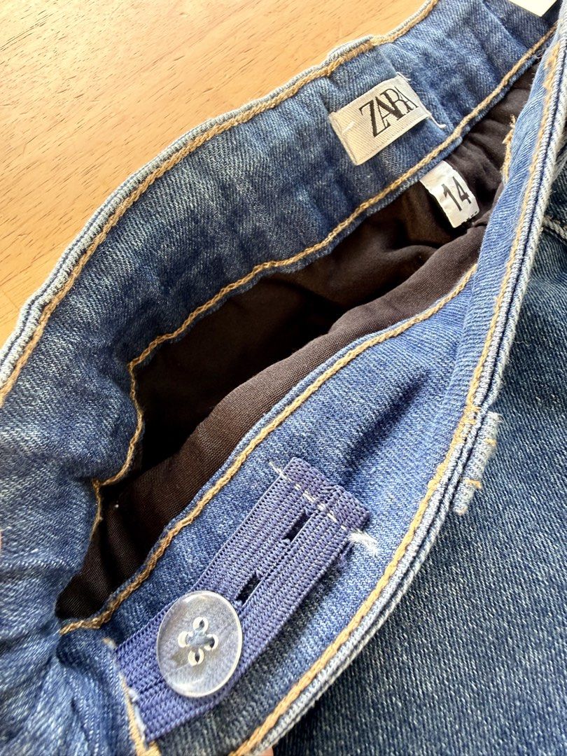 denim ruffle skort size 14 (Category: Skirts) located in Agdangan. Submitted by onahhhh (Listing ID 1469773458, Image 2). Description: - Brand: Zara - Size: 14 (with adjustable inner elastic waistband for custom fit) - Color: Classic blue denim - Style: Flared tiered skirt with double ruffle hem - Features: Five-pocket styling, belt loops, and front button closure - Condition: Great wardrobe staple, easy to pair with tees or sweaters.