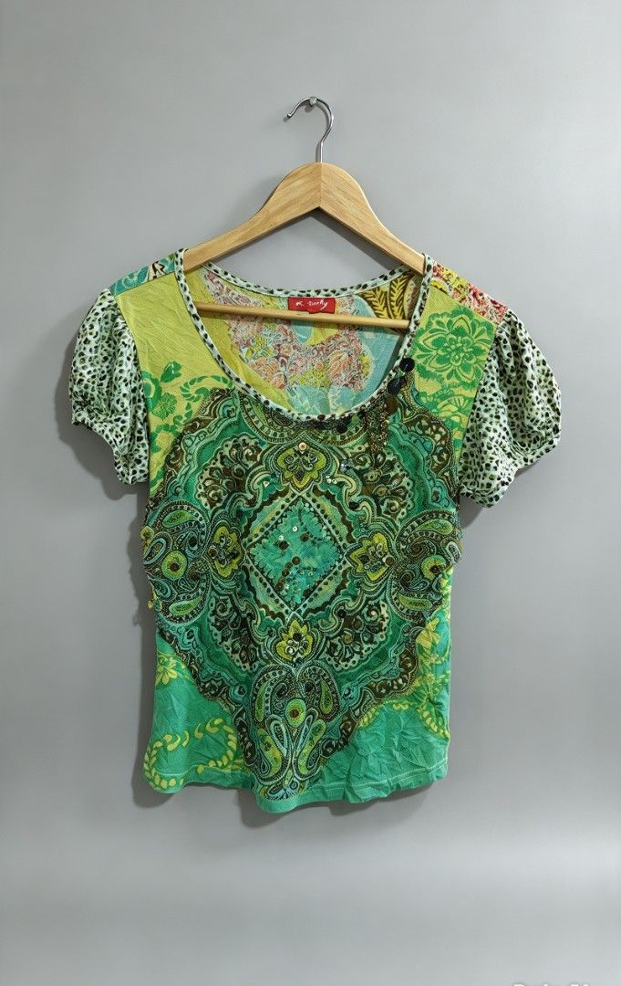 Derhy Green Paisley Sequin Blouse Size L (Category: Blouses) located in San Francisco. Submitted by Intaw20 (Listing ID 1469800083, Image 1). Description: - Vintage Derhy - Size: Large - Color: Green with bold paisley pattern and colorful floral panels - Accents: Sequins, beads, and hanging metallic charms along the scoop neckline - Sleeves: Puffed sleeves with subtle animal print trim - Fabric: Lightweight with a crinkled texture - Condition: Ex