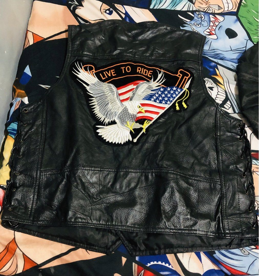 Diamond Plate Genuine Leather Biker Vest (Category: Vests) located in Manila. Submitted by gobvs222 (Listing ID 1469927000, Image 2). Description: - Brand: Diamond Plate - Material: Genuine black leather - Design: Large embroidered 'Live to Ride' eagle and American flag back patch - Hardware: Heavy-duty metal snap buttons with buffalo details - Fit: Adjustable lace-up sides for a custom fit - Storage: Multiple front pockets - Style: Classic heavy