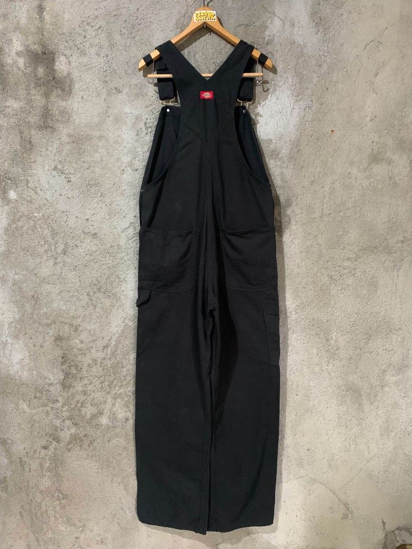Dickies Black Workwear Overalls Dungarees (Category: Sets & Coordinates) located in Bulacan. Submitted by lzl_thriftfinds (Listing ID 1469768970, Image 3). Description: - Brand: Dickies - Color: Solid black - Material: Heavy-duty duck canvas - Style: Classic carpenter with utility pockets and hammer loop - Features: Branded brass buttons, metal buckles, adjustable shoulder straps, and iconic red logo patch on chest - Pockets: Deep front and back 