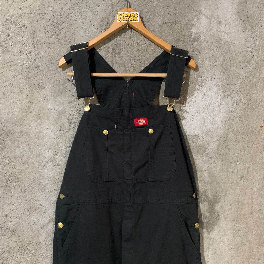Dickies Black Workwear Overalls Dungarees (Category: Sets & Coordinates) located in Bulacan. Submitted by lzl_thriftfinds (Listing ID 1469768970, Image 2). Description: - Brand: Dickies - Color: Solid black - Material: Heavy-duty duck canvas - Style: Classic carpenter with utility pockets and hammer loop - Features: Branded brass buttons, metal buckles, adjustable shoulder straps, and iconic red logo patch on chest - Pockets: Deep front and back 