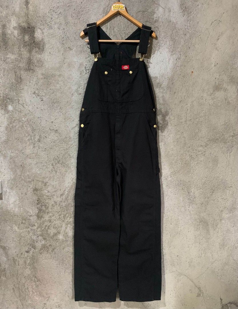 Dickies Black Workwear Overalls Dungarees (Category: Sets & Coordinates) located in Bulacan. Submitted by lzl_thriftfinds (Listing ID 1469768970, Image 1). Description: - Brand: Dickies - Color: Solid black - Material: Heavy-duty duck canvas - Style: Classic carpenter with utility pockets and hammer loop - Features: Branded brass buttons, metal buckles, adjustable shoulder straps, and iconic red logo patch on chest - Pockets: Deep front and back 