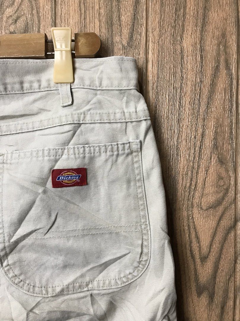 Dickies Canvas Cargo Shorts Beige (Category: Shorts) located in Aloguinsan. Submitted by jayhooukay (Listing ID 1469863438, Image 2). Description: - size 36 22 length 11.5 leg open - Brand: Dickies - Color: Classic beige - Material: Sturdy, durable canvas construction - Design: Utility style with multiple functional pockets (side cargo and rear welt pockets) - Details: Branded button closure and signature Dickies woven logo patch on the back - Co