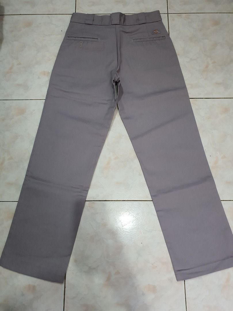 Dickies Grey Work Pants (Category: Trousers) located in Caloocan City. Submitted by cleverwind_1e53ab (Listing ID 1469804957, Image 2). Description: - Brand/Item: Grey Dickies work pants - Fit/Style: Classic straight leg with standard belt loops - Material: Sturdy twill fabric, great for everyday wear - Closure: Front button and zipper fly - Features: Convenient back pockets - Condition: Clean condition all around -size W30 L32.