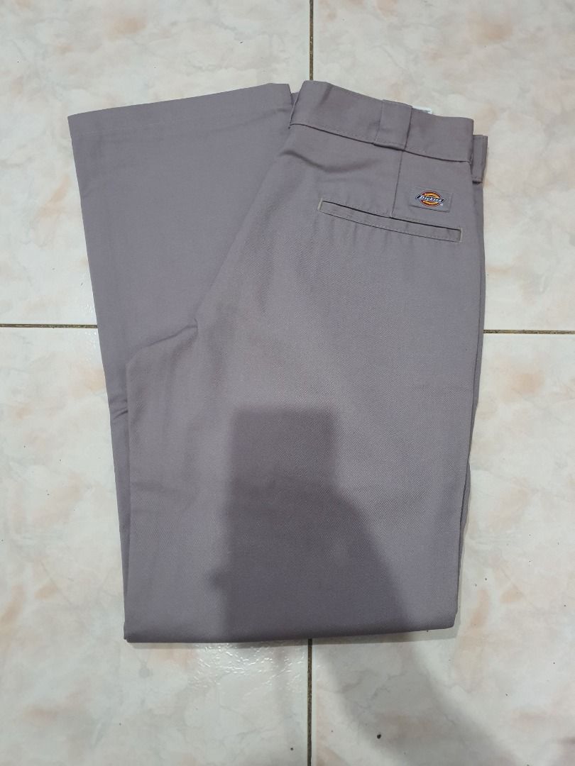 Dickies Grey Work Pants (Category: Trousers) located in Caloocan City. Submitted by cleverwind_1e53ab (Listing ID 1469804957, Image 1). Description: - Brand/Item: Grey Dickies work pants - Fit/Style: Classic straight leg with standard belt loops - Material: Sturdy twill fabric, great for everyday wear - Closure: Front button and zipper fly - Features: Convenient back pockets - Condition: Clean condition all around -size W30 L32.
