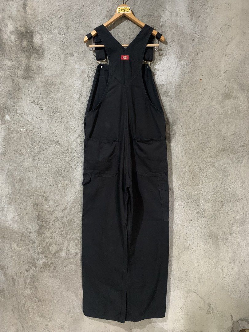 Dickies Overall Solid Black size32 (Category: Coats, Jackets and Outerwear) located in Bulacan. Submitted by puronghustlin (Listing ID 1469775068, Image 3). Description: - Brand: Dickies - Color: Solid black - Material: Heavy-duty duck canvas - Style: Classic carpenter with utility pockets and hammer loop - Features: Branded brass buttons, metal buckles, adjustable shoulder straps, and iconic red logo patch on chest - Pockets: Deep front and back
