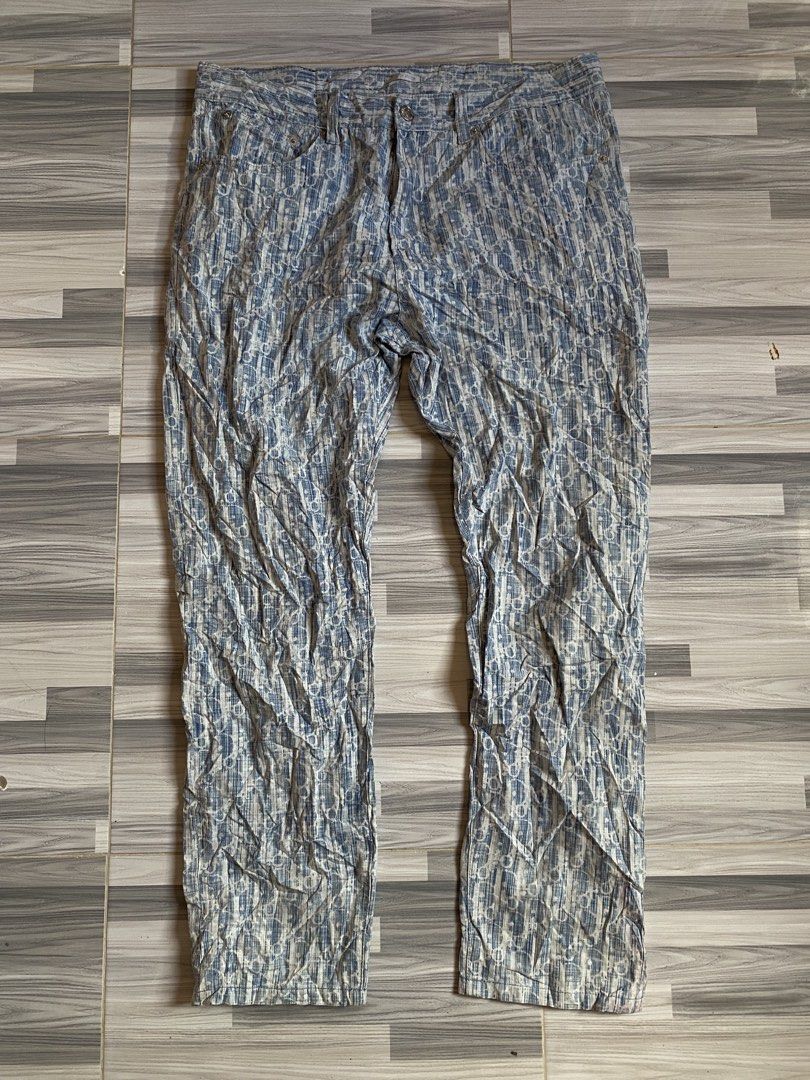 Dior Homme Blue Patterned Trousers Size 34 (Category: Luxury Apparel) located in Bayambang. Submitted by vintagestuffph (Listing ID 1469809367, Image 1). Description: - Brand: Dior Homme - Color/Pattern: Blue and white patterned fabric - Size: 34 - Fit: Regular straight fit - Closure: Button fly with branded metal hardware - Material: Cotton blend with leather label detail - Origin: Made in Italy - Condition: Clean, ready to wear.