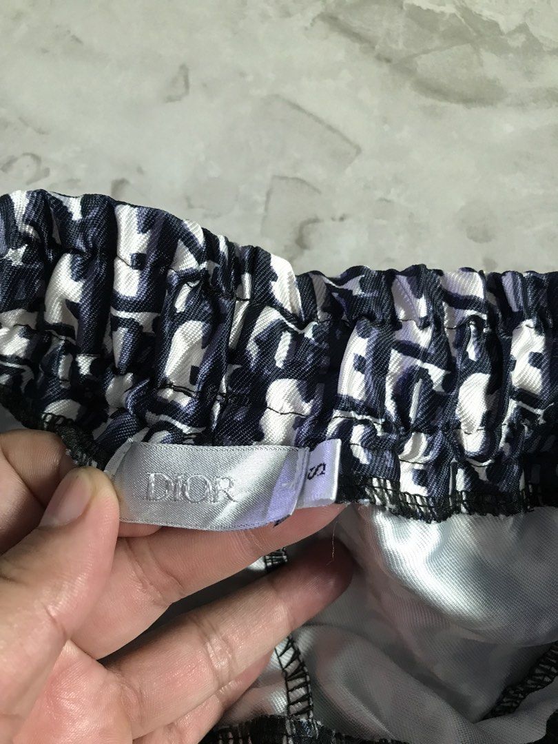Dior Monogram Print Swim Shorts Size S (Category: Shorts) located in Manila. Submitted by brighthorse.b8f582 (Listing ID 1469762978, Image 2). Description: - Iconic black and white Dior monogram print all over - Comfortable elastic waistband with adjustable black drawstring and metal tips - Secure storage with two front zippered pockets and stylish black pulls - Crafted from a smooth and lightweight fabric for everyday comfort - Size: Small (S).