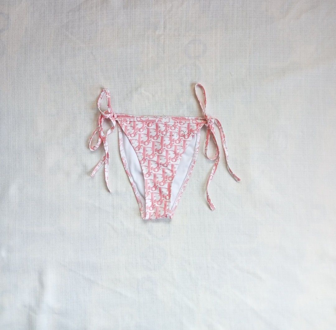Dior pink trotter monogram bikini set (Category: Luxury Apparel) located in Bagabag. Submitted by thrift_stories96 (Listing ID 1469783542, Image 3). Description: Dior pink trotter monogram bikini set With removable pads Small to medium frame Waistline - 26 to 28 Adjustable drawstring Length - 9.5 Condition - excellent No flaw.