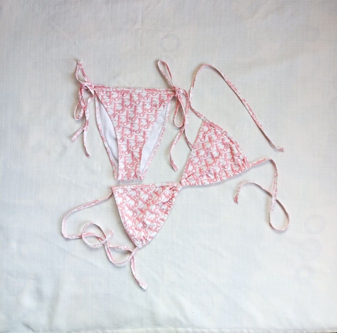 Dior pink trotter monogram bikini set (Category: Luxury Apparel) located in Bagabag. Submitted by thrift_stories96 (Listing ID 1469783542, Image 1). Description: Dior pink trotter monogram bikini set With removable pads Small to medium frame Waistline - 26 to 28 Adjustable drawstring Length - 9.5 Condition - excellent No flaw.