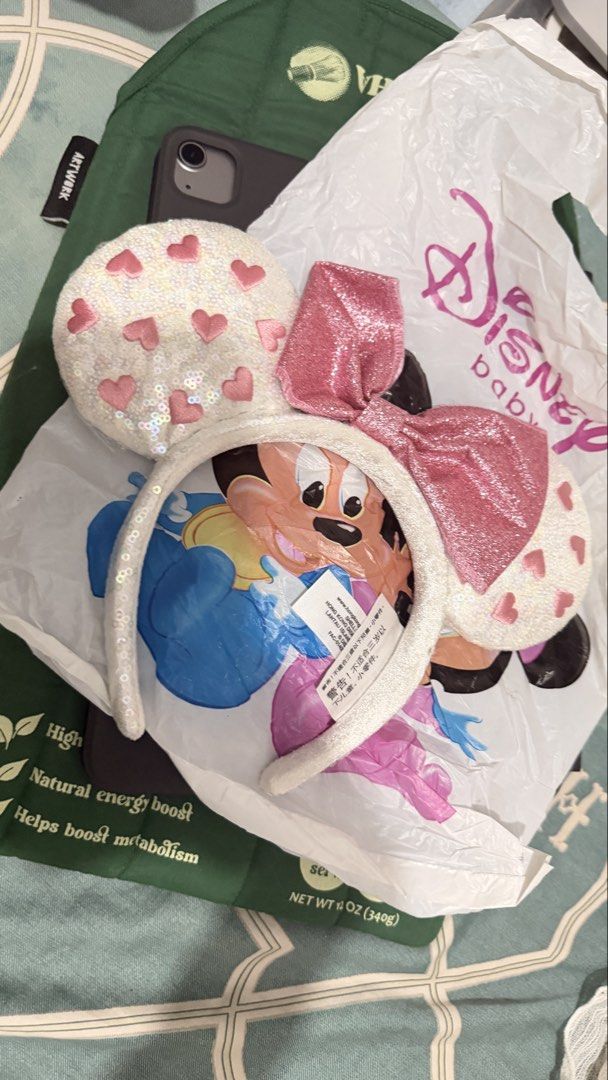 Disney Minnie Mouse Sequin Ears Headband (Category: Hair Accessories) located in Manila. Submitted by backupaccount2 (Listing ID 1469790709, Image 1). Description: - Condition: Brand new with tag attached - Design: White sequin ears with pink hearts and a center pink glitter bow - Band: Comfortable white sequin headband - Perfect for: Theme park trips, Disneyland, or Disney collections.