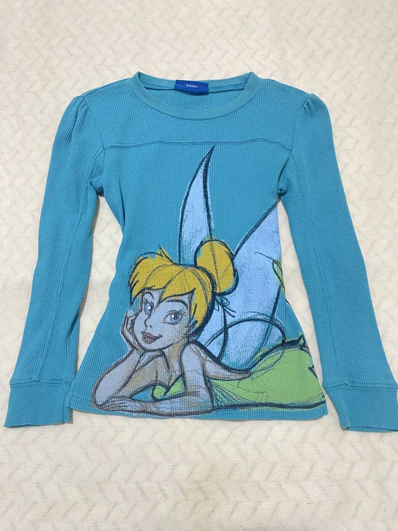 Disney Tinker Bell Graphic 3/4 Sleeve Tee (Category: Longsleeves) located in Marilao. Submitted by kyssmarila (Listing ID 1469907697, Image 1). Description: — Size: XXS-XS (stretchy) — DIMES: 13-15”x18” — Flaws: minimal not noticeable stain in the back.