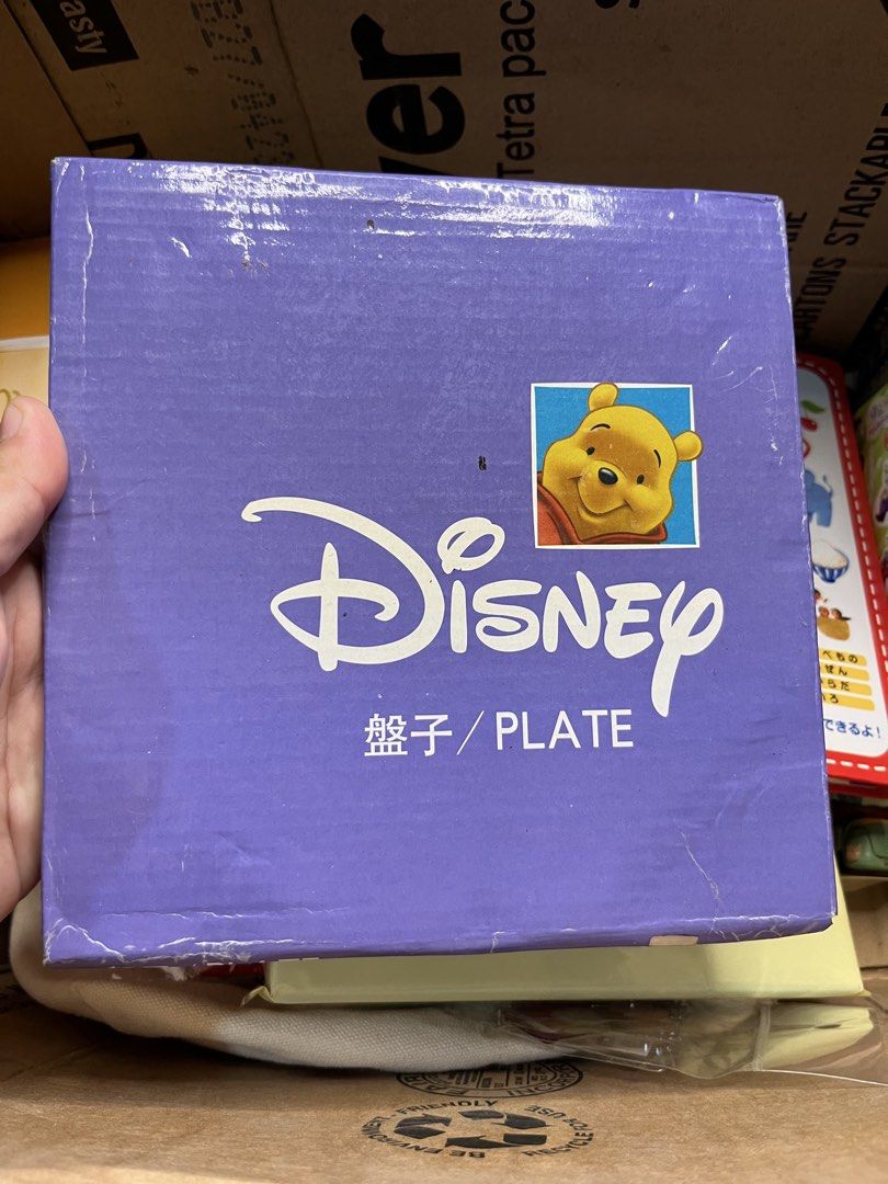 Disney Winnie the Pooh ceramic plate with box (Category: Dinnerware & Cutlery) located in Gapan. Submitted by lunashop14 (Listing ID 1469824496, Image 1). Description: - Official Disney merchandise: Winnie the Pooh & Piglet ceramic plate by Way Link - Design: Features Pooh and Piglet with lovely floral accents and butterflies - Size: Standard dessert/snack plate size - Packaging: Includes original purple Disney branded storage box - Condition: Br