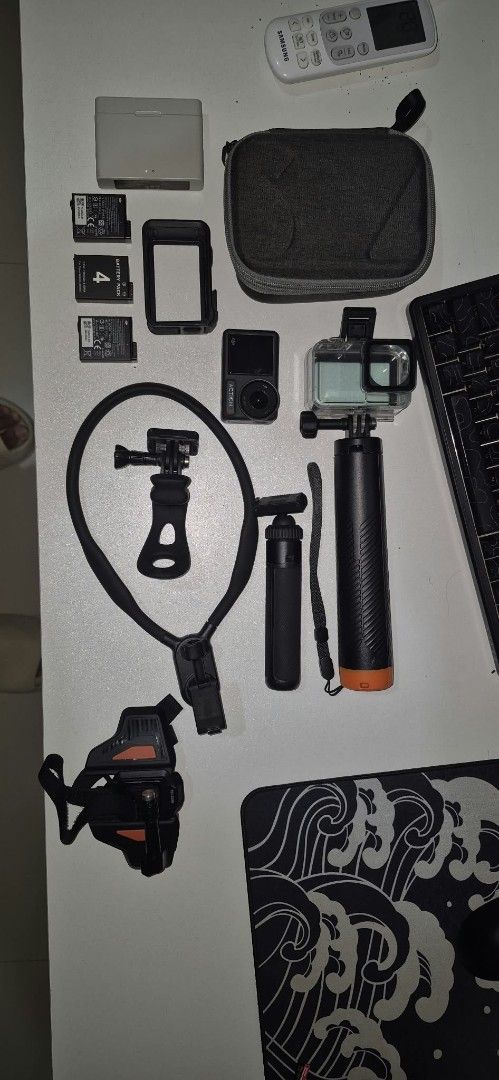 DJI Osmo Action 4 camera bundle with accessories and case (Category: Video Cameras) located in Manila. Submitted by vjzfermala02976 (Listing ID 1469883712, Image 1). Description: - 14k Asking price but still negotiable - DJI Osmo Action camera in great working condition - 3 batteries and a charging case - Waterproof housing case - Mounts included: neck holder, head strap, frame case, and small tripod - Larger selfie stick with orange base - Grey 