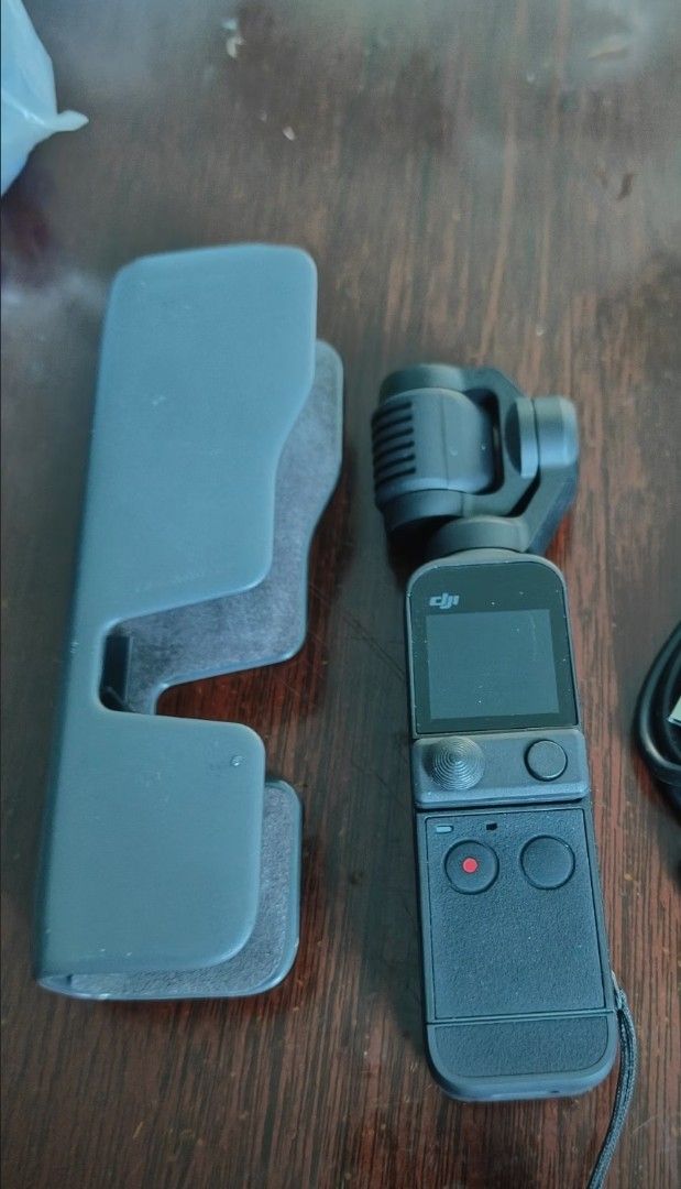 DJI Osmo Pocket 2 Creator Combo Gimbal Camera (Category: Video Cameras) located in Caloocan City. Submitted by afkafk088 (Listing ID 1469930594, Image 1). Description: - DJI Osmo Pocket 2 handheld camera with motorized gimbal - 256gb memory card - Includes protective case with slots for smartphone adapter and wide-angle lens - Fully functional with minor handling wear .